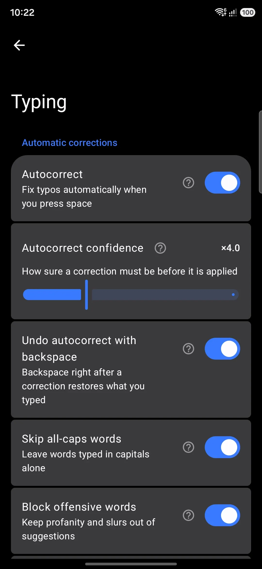 The Automatic corrections group in Typing settings, including the confidence slider.