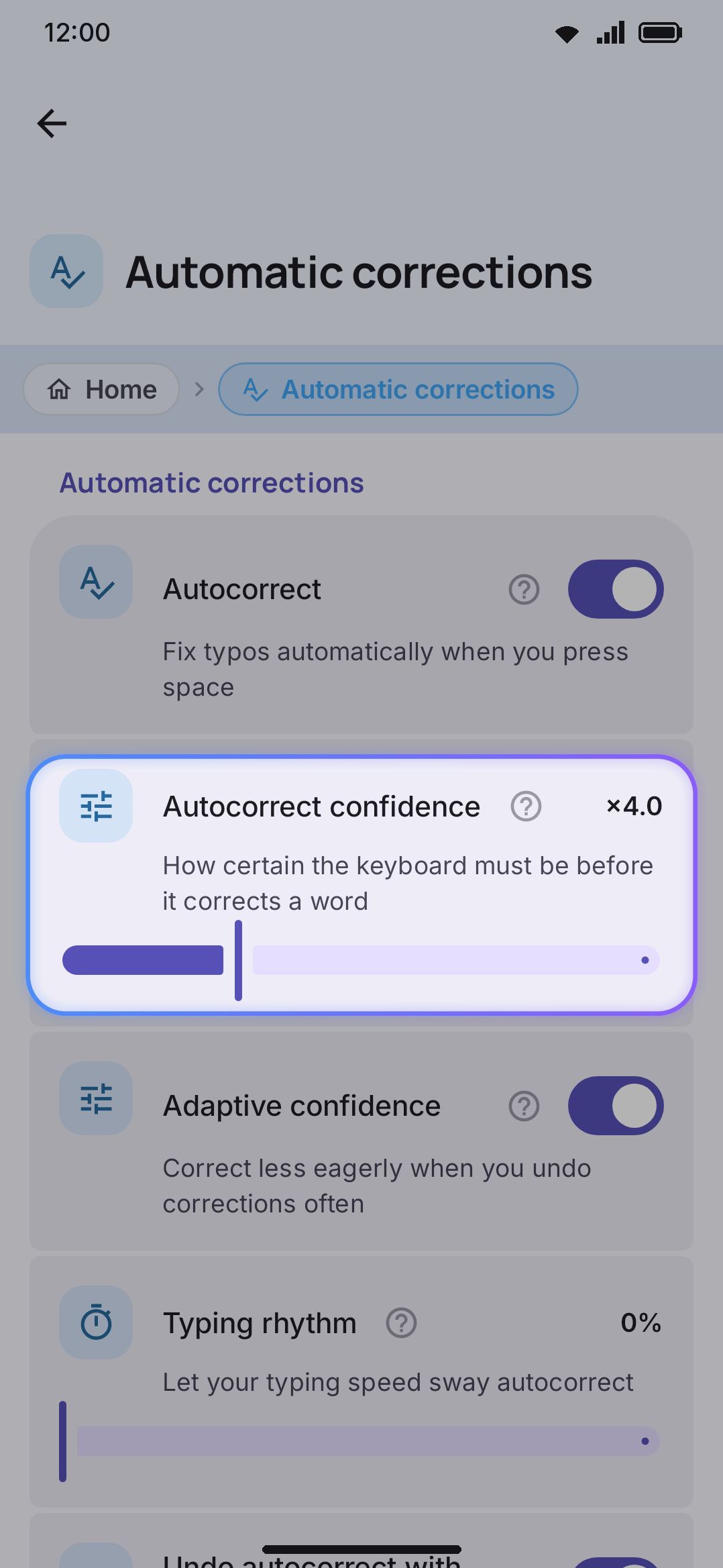 The Automatic corrections group in Typing settings, including the confidence slider.