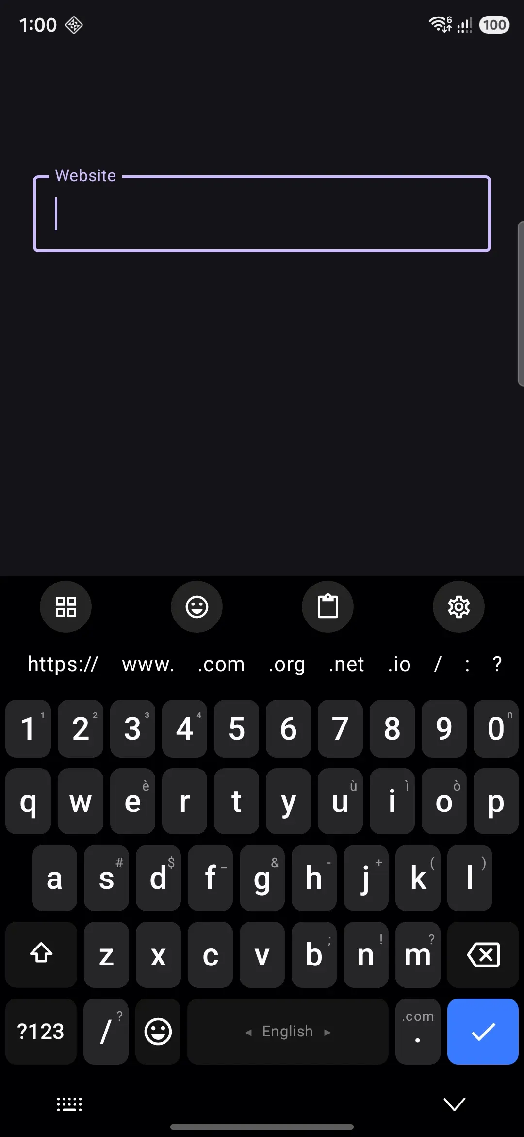 A URL field: the comma key has become /, with ? # & = on its long-press.