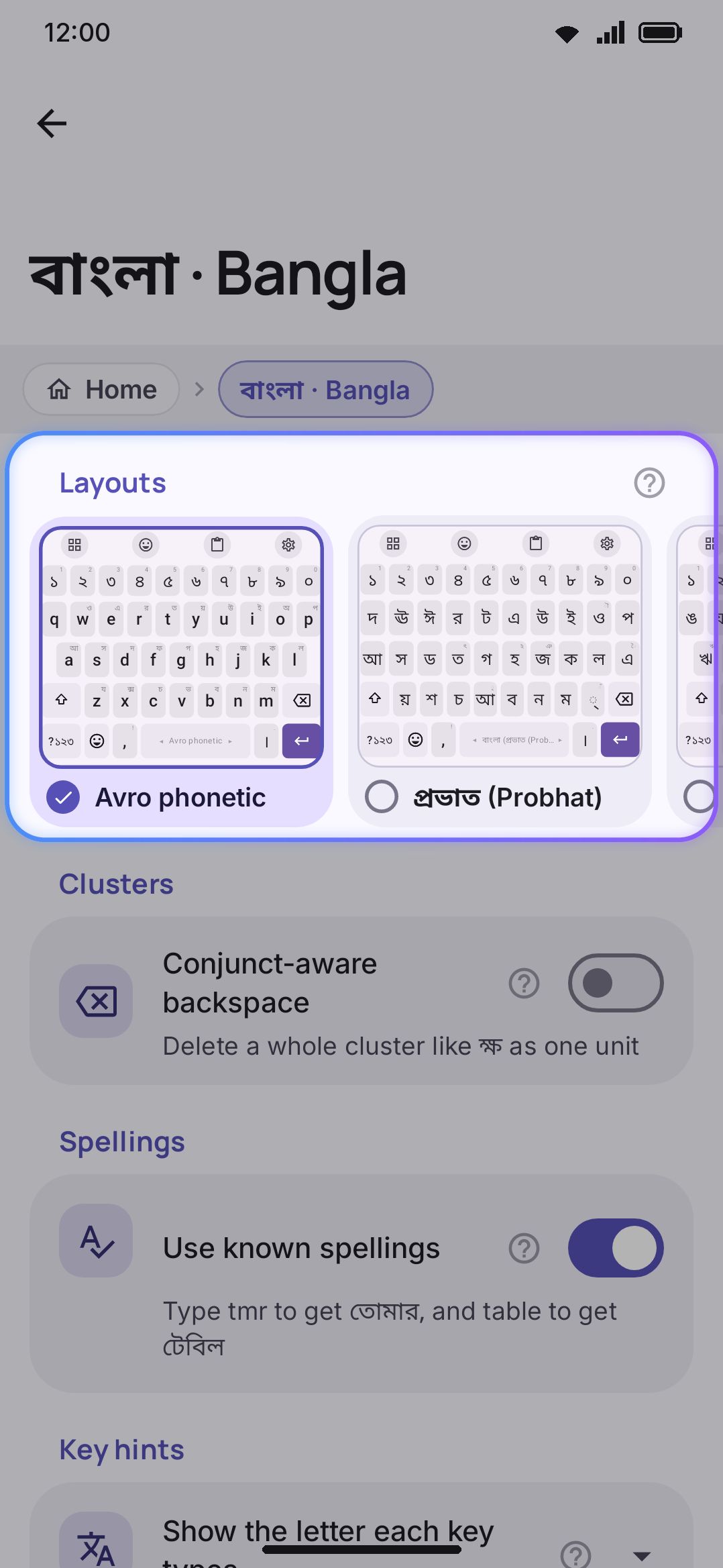 A language's own screen: a row of layout cards, numeral system, and other enabled languages to suggest from.